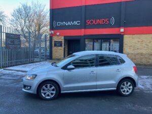 VW Polo 2013 model fitted with color coded rear parking sensors.